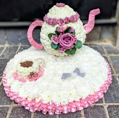 Tea pot with cup and saucer
